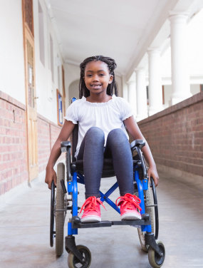 girl in wheelchair smiling