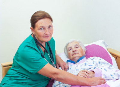 elderly women with her caregiver at home